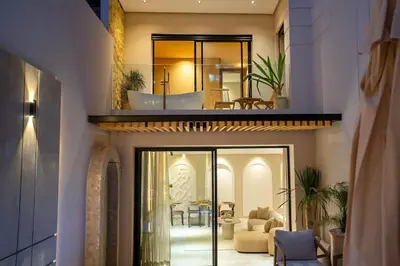 a house with a view of a living room at Spacious duplex Private HEATED pool Jacuzzi in Marrakech