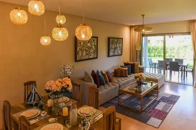 a living room with a couch and a table at Prestigia Jade in Marrakech