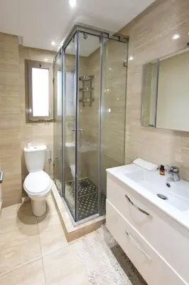 a bathroom with a shower and a toilet and a sink at Prestigia Jade in Marrakech