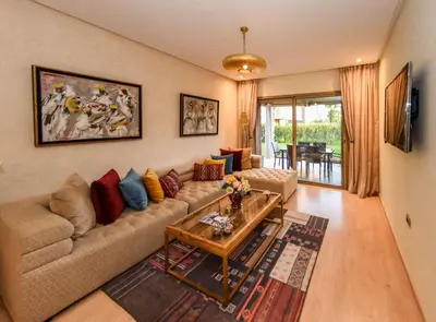 a living room with a couch and a table at Prestigia Jade in Marrakech