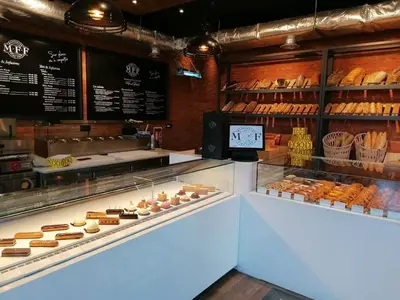 a bakery with a display case filled with lots of pastries at Appartement 2 chambres avec grand jardin Noria Golf in Marrakech