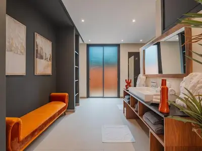 a bathroom with a sink and a large mirror at Rixos Palm villas with a heated private pool & garden in Marrakech