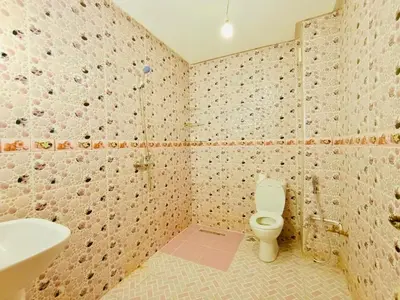 a bathroom with a toilet and a sink at Nice apart wi-fi 3rd floor in El Gouassem