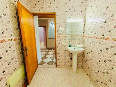 a bathroom with a sink and a toilet at Nice apart wi-fi 3rd floor in El Gouassem