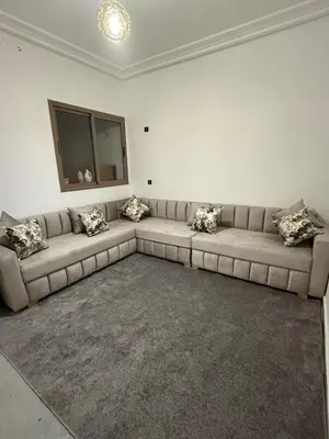 a living room with a couch and a television at Marrakech appartement in Marrakech