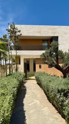 a building with a pathway in front of it at Exceptional Villa Noria Golf in Marrakech