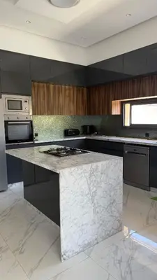 a kitchen with a marble counter top in a room at Exceptional Villa Noria Golf in Marrakech