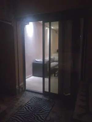 a room with a mirror and a bed in a room at chambre Economic Gueliz in Marrakech