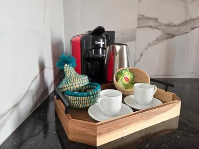 a tray with coffee cups and baskets on a counter at Quiet and comfortable apartment in Marrakech