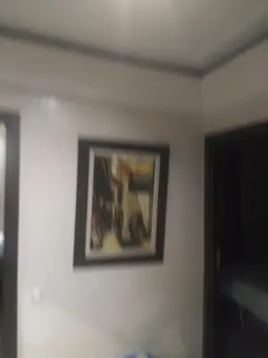 a picture hanging on a wall in a room at chambre Economic Gueliz in Marrakech