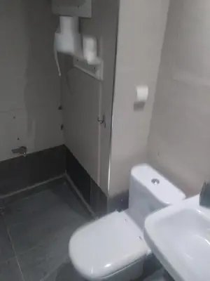 a bathroom with a white toilet and a sink at chambre Economic Gueliz in Marrakech