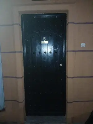 a black door with the number on it at Appartement Chez Anita in Marrakech