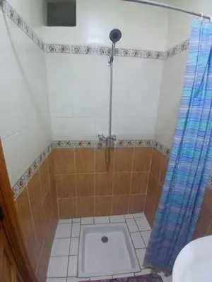 a bathroom with a shower with a toilet at Appartement Chez Anita in Marrakech