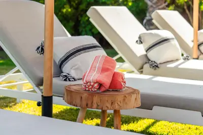 a table with some pillows and a table with a table at Oasis Privée - Dar Lola in Marrakech