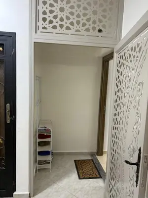 a hallway with a door with a white ceiling at KSYI IMMO 4 Marrakech Aéroport in Marrakech