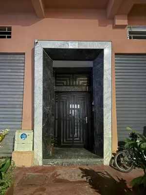 an entrance to a building with a black door at KSYI IMMO 4 Marrakech Aéroport in Marrakech