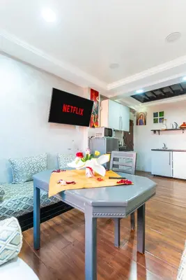 a table with a napkin on it in a kitchen at Lely appartement 2min de là garé in Marrakech