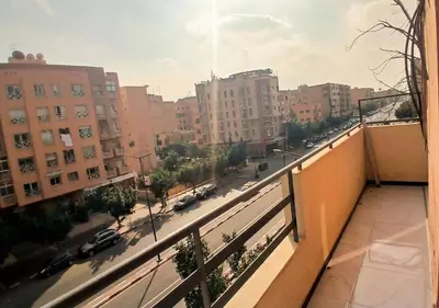 a view of a city street from a balcony at Appart zénith in Marrakech