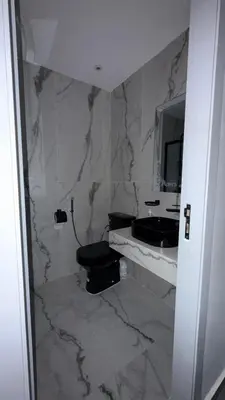 a bathroom with a toilet and a sink and a mirror at Beautiful suite Apartment in the heart of Marrakech in Marrakech