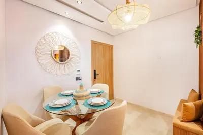 a dining room with a table and chairs at NEW Guéliz I Blue Mirage I Crafts and modernity in Marrakech