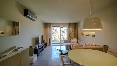 a living room with a couch and a table at Suites 25, Hivernage, Calme, 2BR, Marrakech in Marrakech