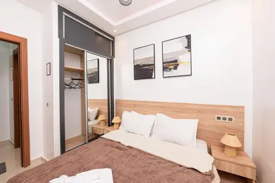 a bedroom with a large bed in a room at Red City Elegant Stay in Marrakech