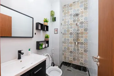 a bathroom with a toilet and a sink at Red City Elegant Stay in Marrakech
