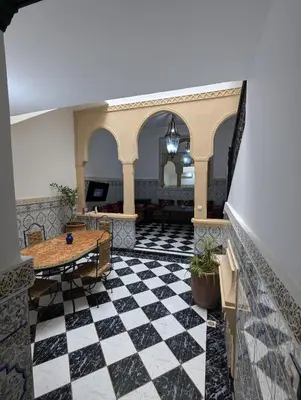 a lobby with a black and white checkered floor at Almohafidon room 2 in Marrakech