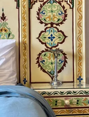 a bedroom with a table with a trophy on it at Résidence Caricia - WiFi, Piscine, Parking, Gardien h24 in Marrakech