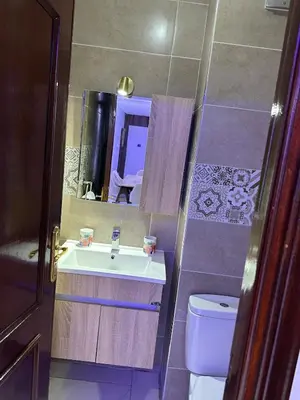a bathroom with a sink and a toilet at Prestige Gueliz city centre appartement in Marrakech