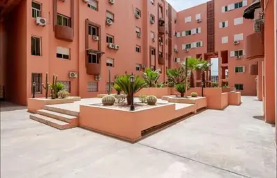 a courtyard in front of a building at Prestige Gueliz city centre appartement in Marrakech