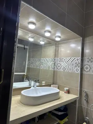 a bathroom with a sink and a mirror at Prestige Gueliz city centre appartement in Marrakech