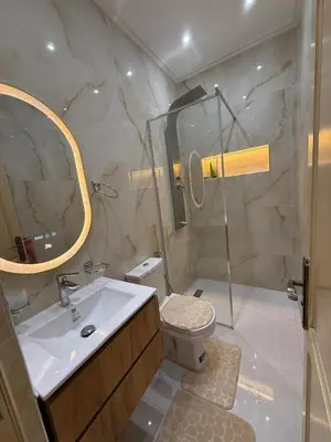 a bathroom with a toilet and a sink and a shower at Dar des étoiles in Marrakech