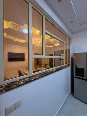 a room with a window with a restaurant sign on it at Dar des étoiles in Marrakech