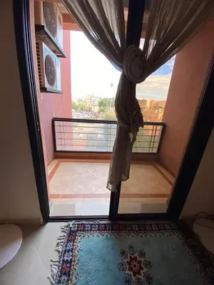 a door leading to a balcony with a window at اقامة كنزي مراكش كليز in Marrakech