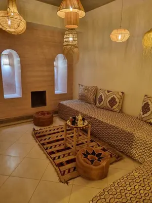 a living room with a couch and a table at La Boheme City Center Entire Unique Appart 3Bdr 3Bthr in Marrakech
