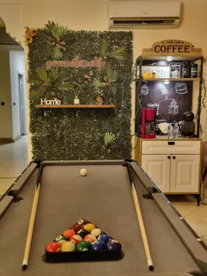 a pool table with balls on top of it at La Boheme City Center Entire Unique Appart 3Bdr 3Bthr in Marrakech