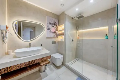 a bathroom with a sink and a shower at White Oasis Swimming pool and Design in Marrakech