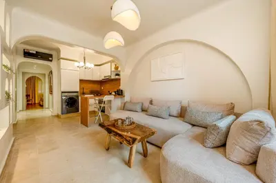 a living room with a couch and a table at White Oasis Swimming pool and Design in Marrakech