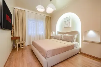 a bedroom with a large bed in a room at White Oasis Swimming pool and Design in Marrakech