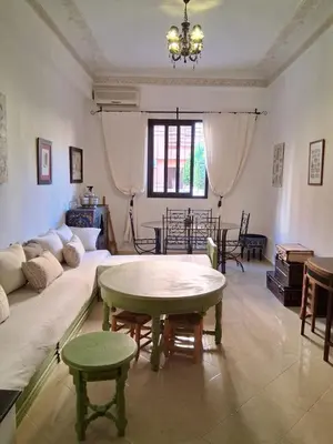 a living room with a couch and a table at Casa Rosa in Marrakech