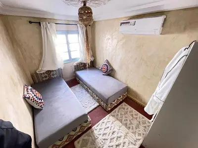 an aerial view of a room with a bed and a window at Riad Elegant suite in the heart of the Medina in Marrakech