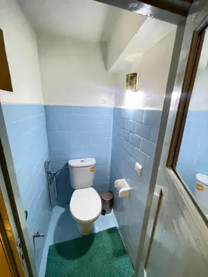a blue bathroom with a toilet and a shower at Riad Elegant suite in the heart of the Medina in Marrakech