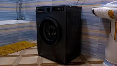 a washing machine in a bathroom next to a toilet at the sweet night of Marrakech in Marrakech