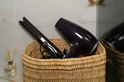 a basket with utensils in it on a counter at Dar élégant au centre de Marrakech piscine in Marrakech