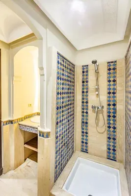 a bathroom with a shower and a sink at Suite Moderne Deluxe Miracle, à Babylone, Hyper-Centre, Marrakesh in Marrakech