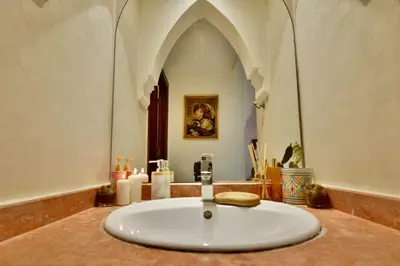 a bathroom with a large white sink in a building at Dar Kech Luxury et comfort in Marrakech