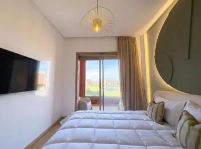 a bedroom with a large bed and a large window at Modern, Luxurious, Pool View, 3 Terraces, Golf in Marrakech