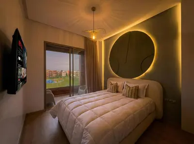 a bedroom with a large bed and a large mirror at Modern, Luxurious, Pool View, 3 Terraces, Golf in Marrakech