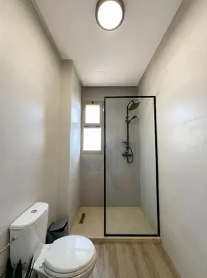 a bathroom with a shower and a toilet at Modern, Luxurious, Pool View, 3 Terraces, Golf in Marrakech